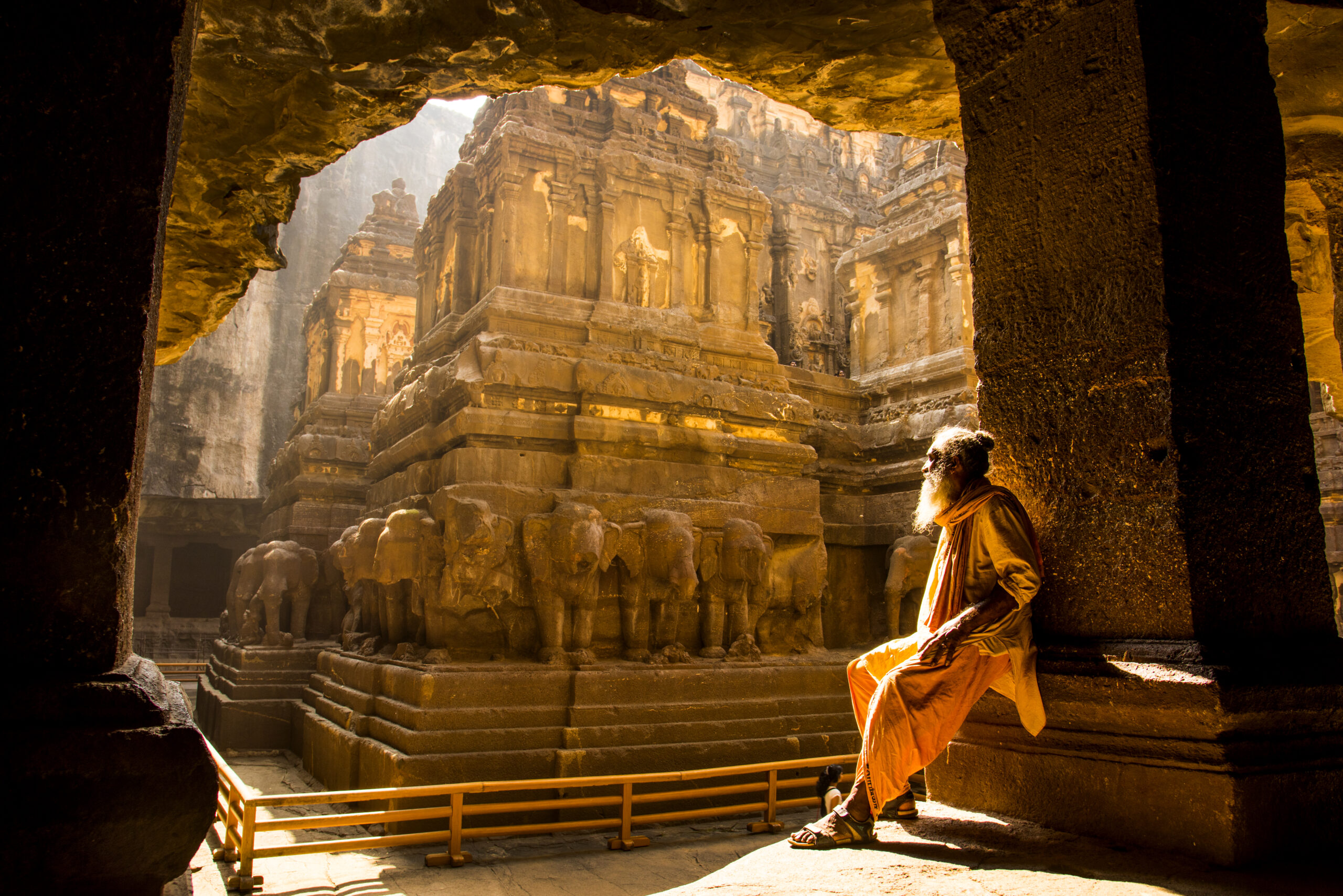 Hindu Sadhu, the holy man, visiting the Kailasa temple at Ellora Caves, India.